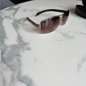 Prada Black and Silver Sunglasses worn for one summer only.  My son has too many